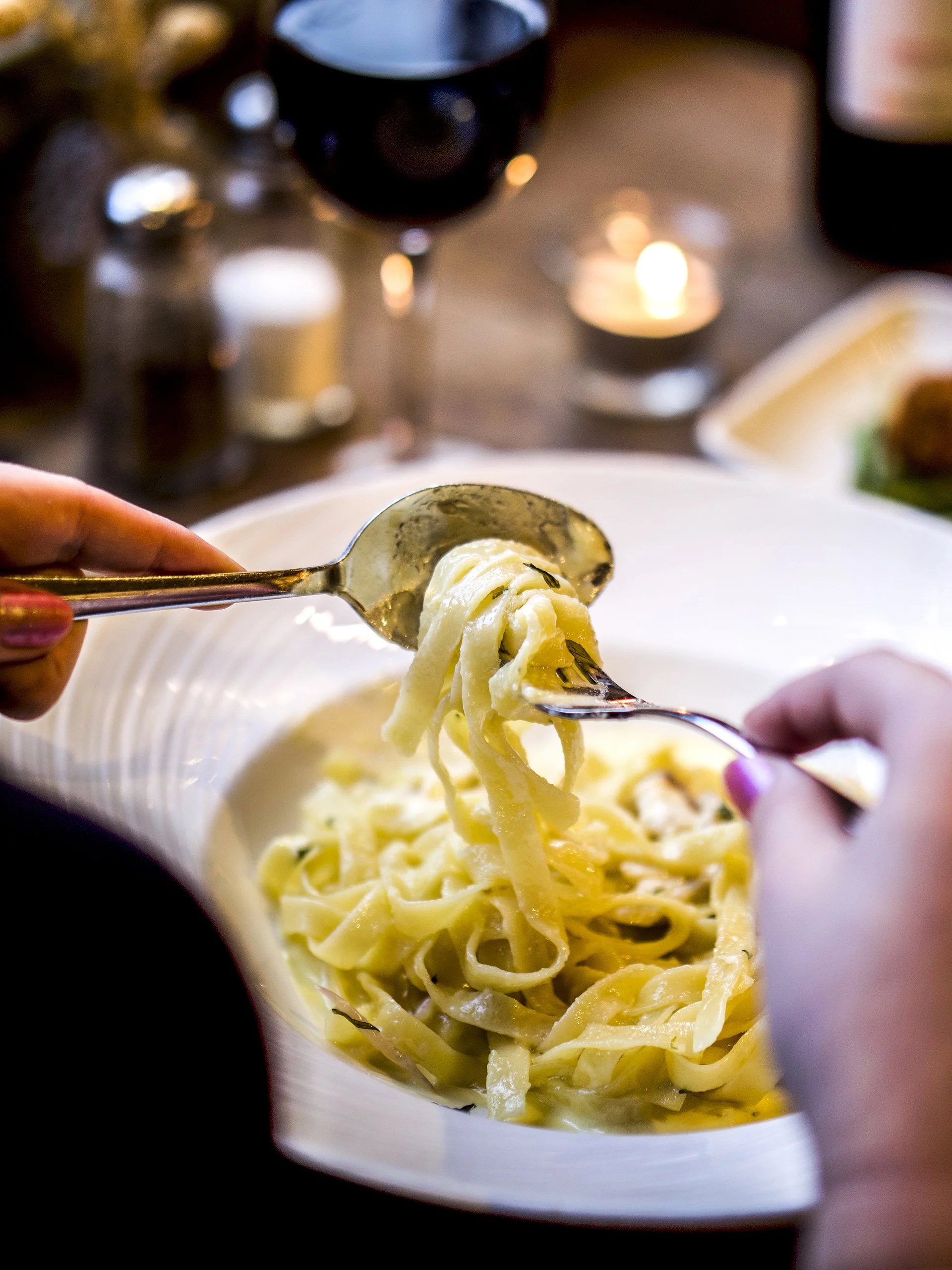 Fresh pasta being enjoyed at the table